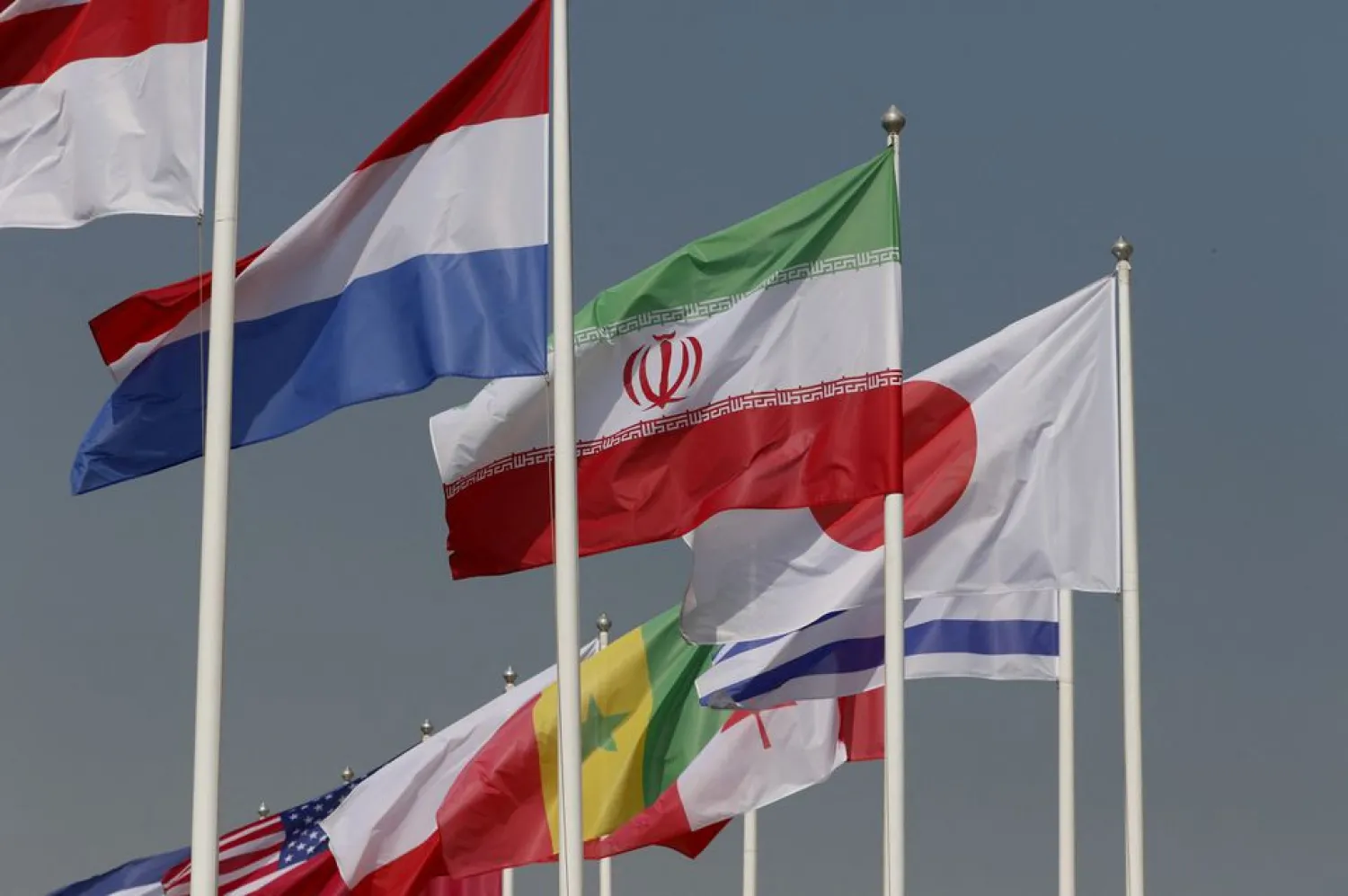 Soccer Football - FIFA World Cup Qatar 2022 Preview - Doha, Qatar - October 26, 2022 General view of the flag of Iran alongside other flags ahead of the World Cup REUTERS/Hamad I Mohammed
