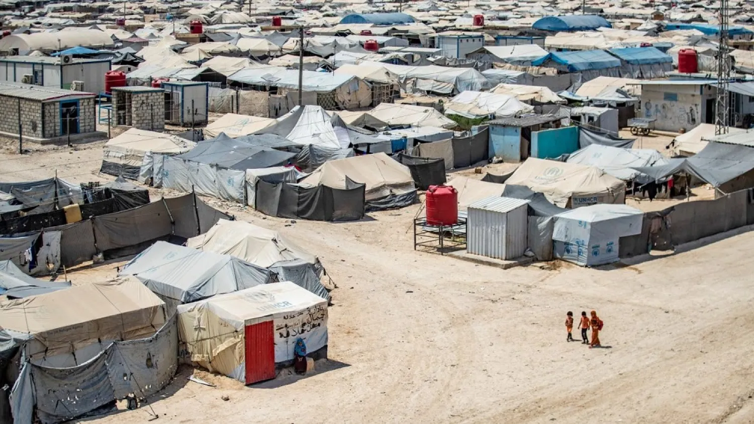 Children walk among shelters at the al-Hol camp in Hassakeh in northeastern Syria. (AFP)

