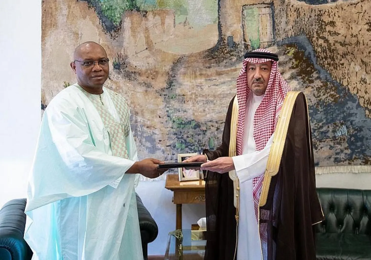 Deputy Foreign Minister Waleed Al-Khuraiji receives the message from Special Envoy of the Guinean President Fode Amadou Fofana. (SPA)
