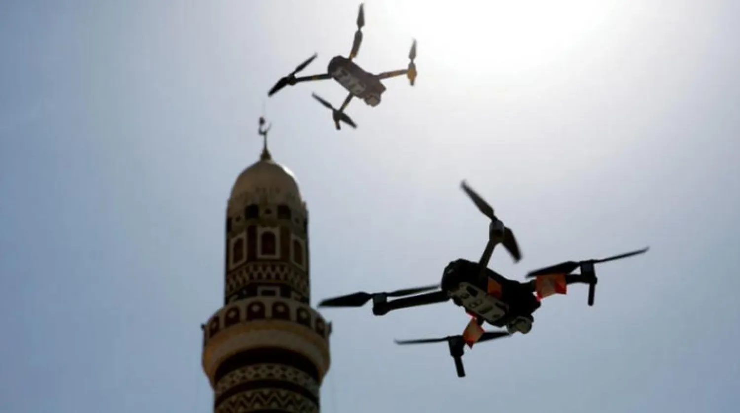  Two Houthi drones fly near the minaret of a mosque in Sanaa (EPA) 

