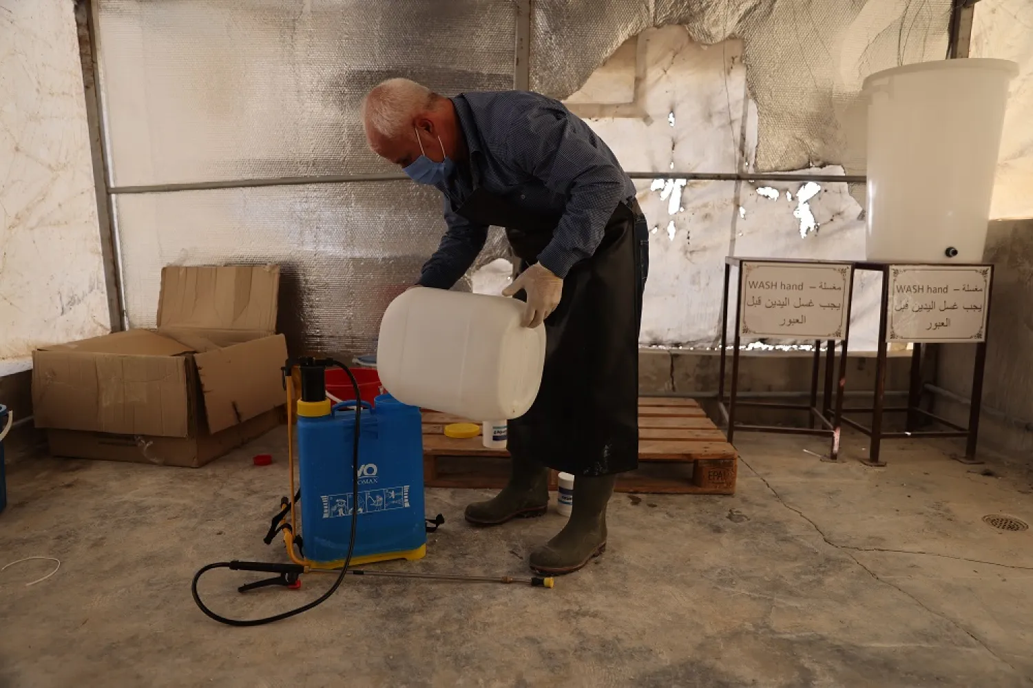 05 November 2022, Syria, Darkoush: A health worker prepares a sterilizer at cholera ward of Al-Rahma Hospital in the city of Darkoush. (dpa)