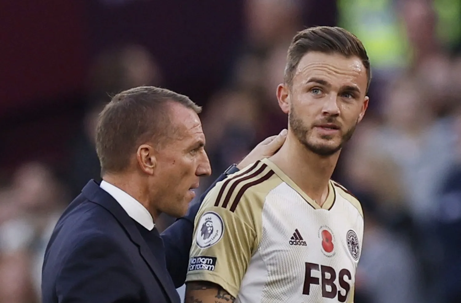Football - Premier League - West Ham United v Leicester City - London Stadium, London, Britain - November 12, 2022 Leicester City's James Maddison is consoled by manager Brendan Rodgers as he walks off to be substituted after sustaining an injury. (Reuters)