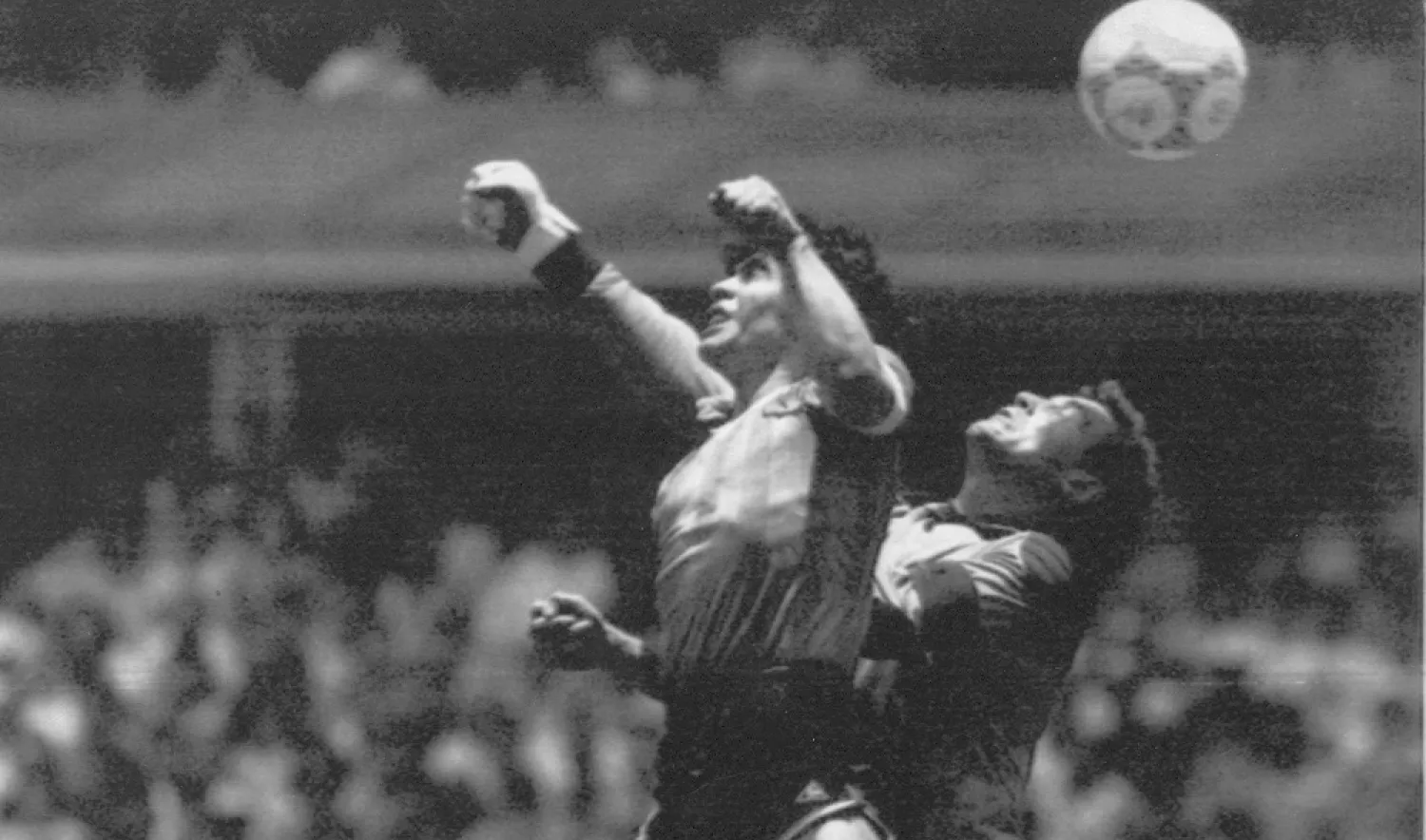 Argentina's Diego Maradona, left, beats England goalkeeper Peter Shilton to a high ball and scores his first of two goals in a World Cup quarterfinal match, in Mexico City on June 22, 1986. (AP)