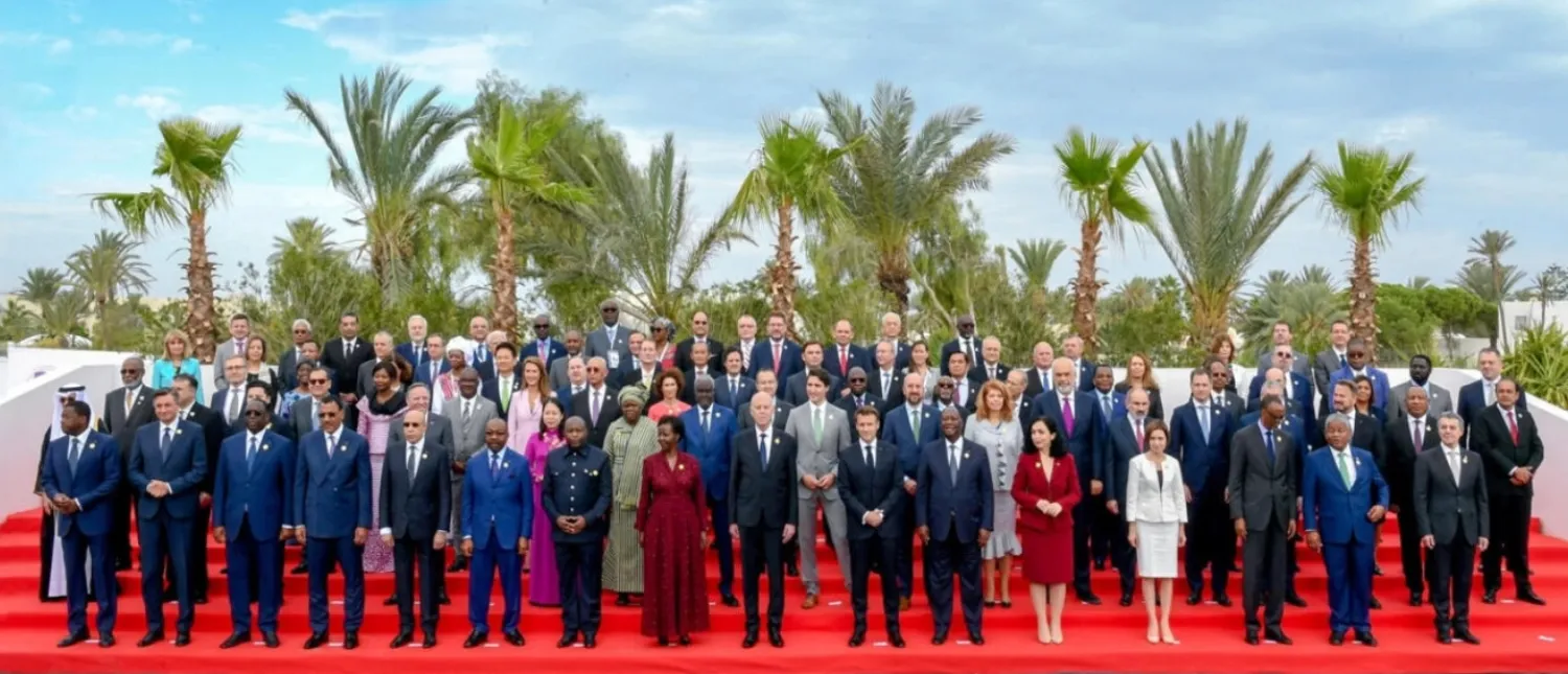 Tunisia's President Kais Saied (center) poses for a group photo with OIF's Sec. Gen. Louise Mushikiwabo, French President Macron, Cote d'Ivoire's President Ouattara, Canada's PM Trudeau, and other officials and leaders of French-speaking countries, at the 18th Francophonie Summit in Djerba, Tunisia November 19, 2022. via REUTERS - TUNISIAN PRESIDENCY