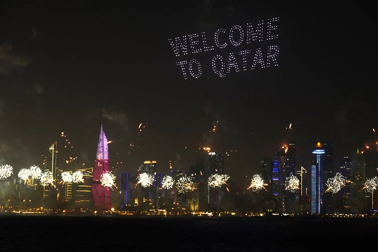 A drone display and fireworks are seen over the skyline ahead of the FIFA World Cup in Doha, Qatar, Saturday, Nov. 19, 2022. (AP)