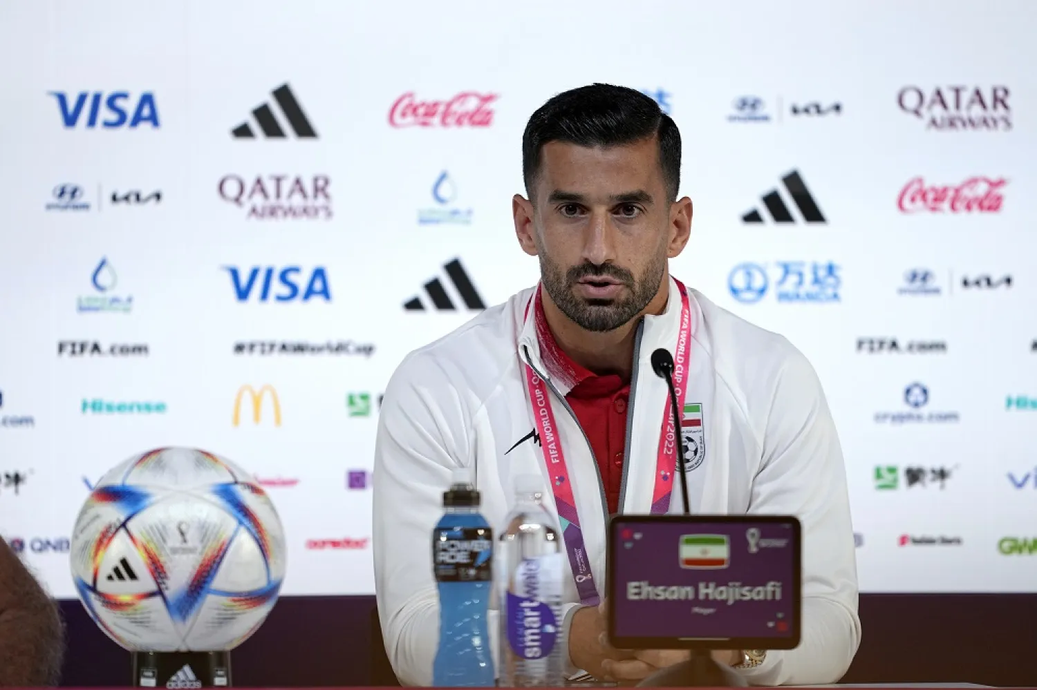 Iran's Ehsan Hajsafi speaks during a press conference at the World Cup press centre in Doha, Qatar, Sunday, Nov. 20,2022. (AP)