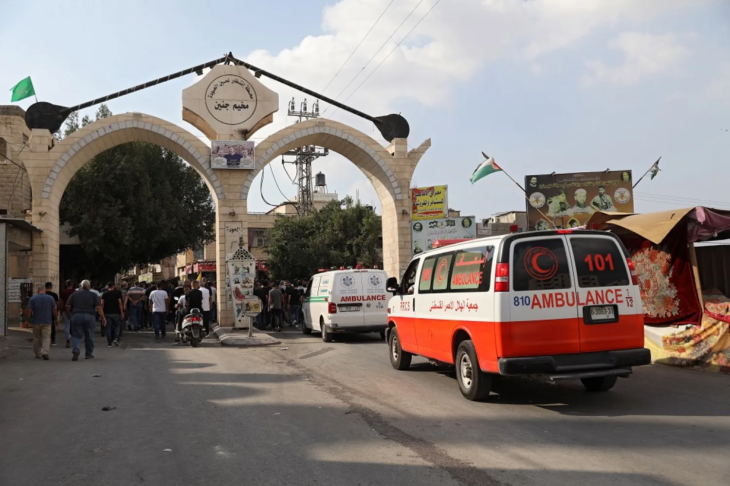 Mourners carry the body of killed Palestinian doctor Abdullah Al-Ahma during his funeral in the West Bank city of Jenin, 14 October 2022. (EPA)