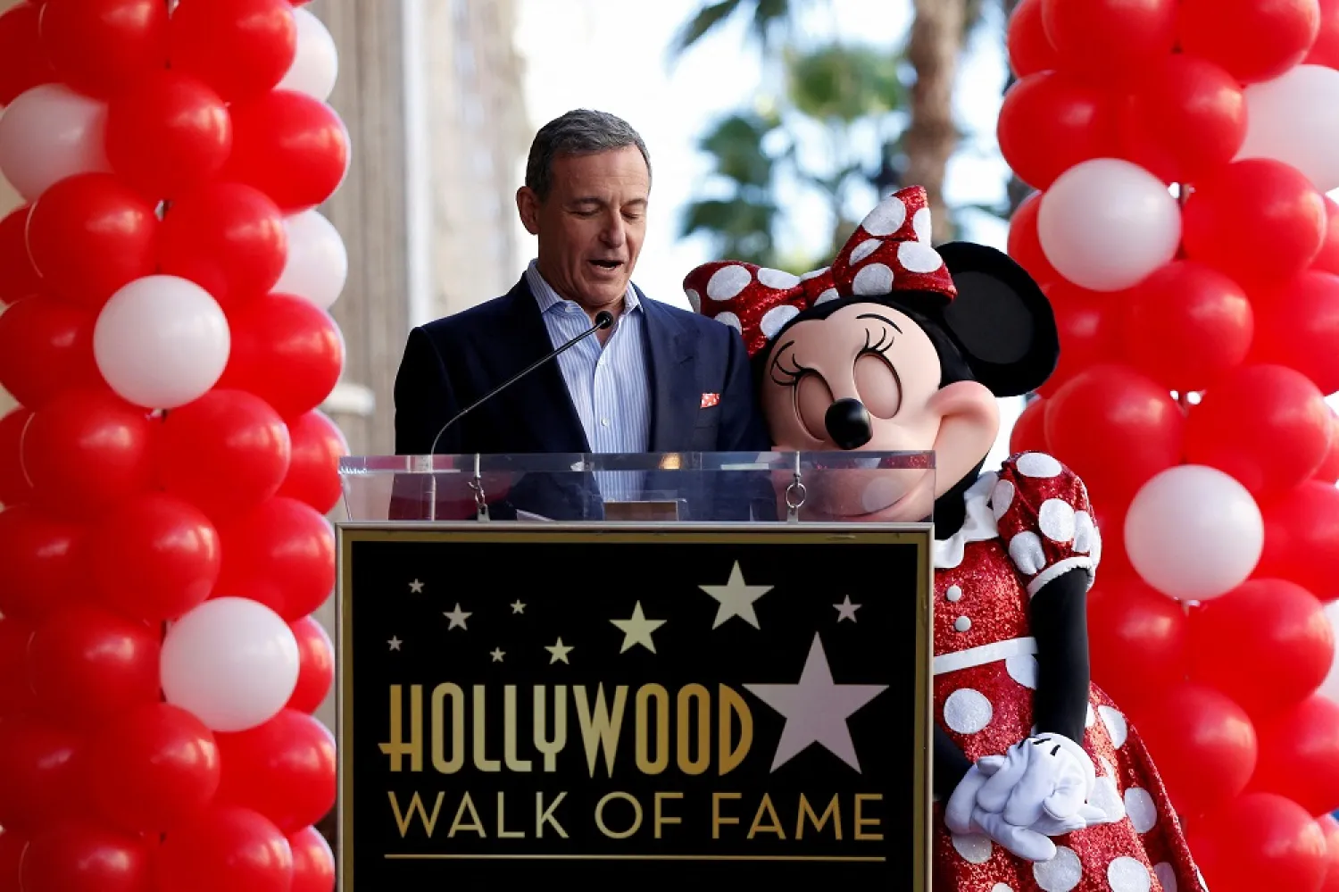 Bob Iger speaks next to the character of Minnie Mouse at the unveiling of her star on the Hollywood Walk of Fame in Los Angeles, California, US, Jan. 22, 2018. (Reuters)
