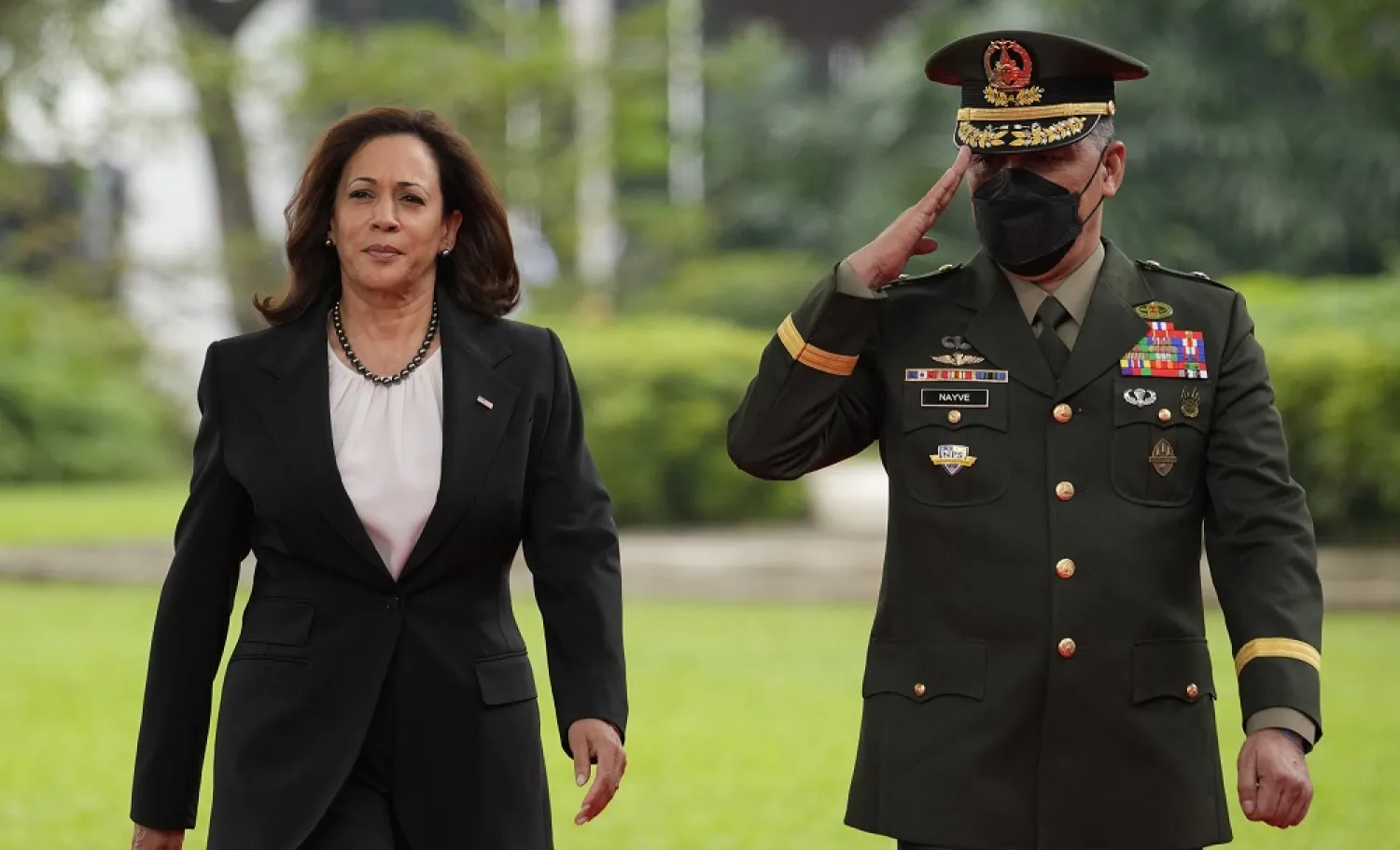 US Vice President Kamala Harris, left, reviews an honor guard at the Malacanang presidential palace in Manila, Philippines on Monday, Nov. 21, 2022. (AP)