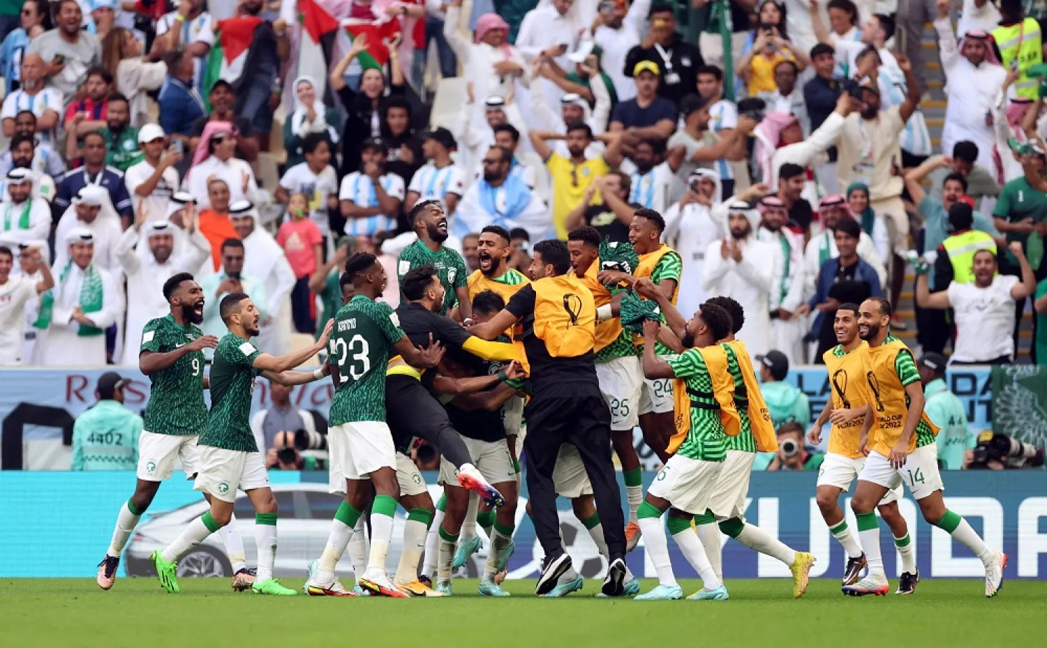 Football - FIFA World Cup Qatar 2022 - Group C - Argentina v Saudi Arabia - Lusail Stadium, Lusail, Qatar - November 22, 2022 Saudi Arabia's Salem Al-Dawsari celebrates scoring their second goal with teammates. (Reuters)