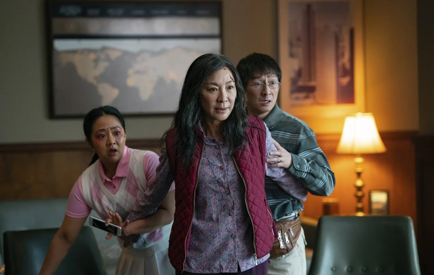 This image released by A24 Films shows, from left, Stephanie Hsu, Michelle Yeoh and Ke Huy Quan in a scene from, "Everything Everywhere All At Once." (A24 Films via AP)