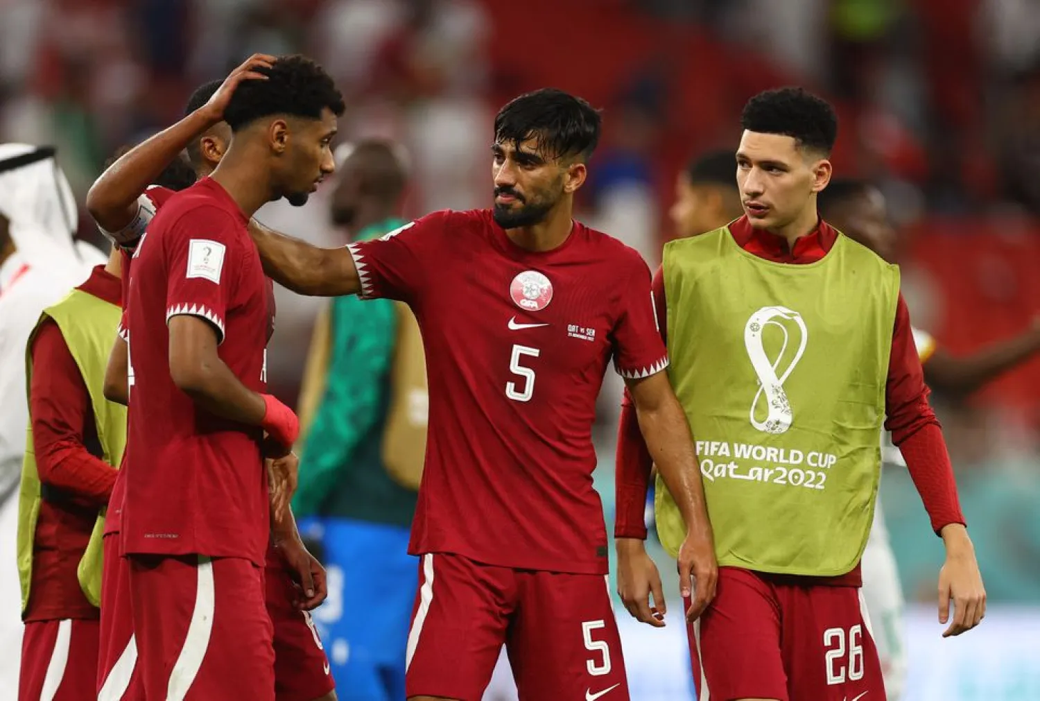 Soccer Football - FIFA World Cup Qatar 2022 - Group A - Qatar v Senegal - Al Thumama Stadium, Doha, Qatar - November 25, 2022 Qatar's Tarek Salman and teammates look dejected after the match REUTERS/Kai Pfaffenbach