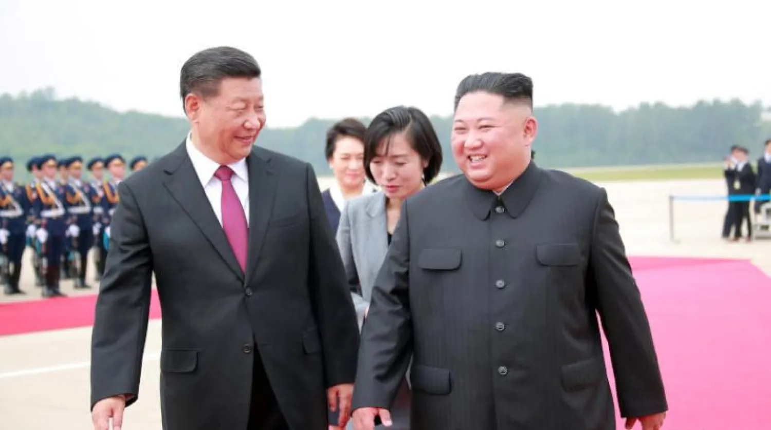 The North Korean leader receives the Chinese president at Pyongyang airport in 2019 (Reuters)