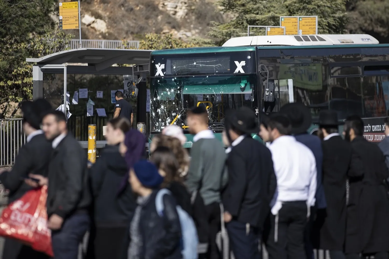 23 November 2022, Israel, Jerusalem: Israeli security forces and forensic experts work at the scene of an explosion at a bus stop in Jerusalem. (dpa)