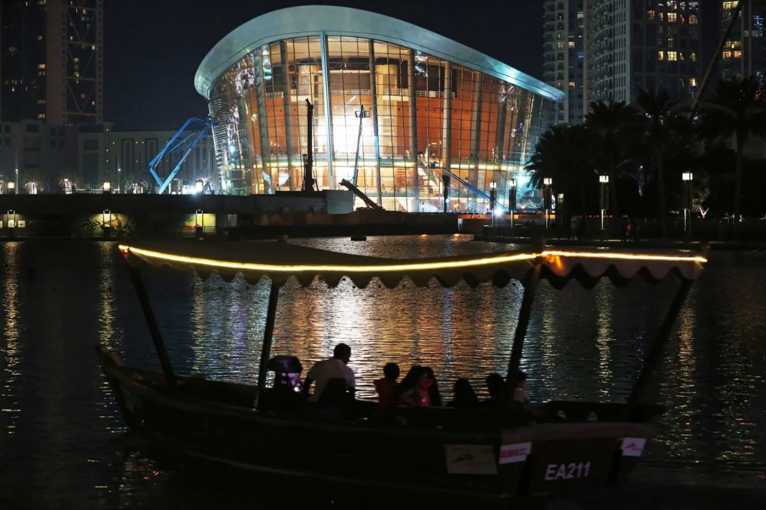 In this Sunday, Aug. 28, 2016 photo, a boat passes by the new
Dubai Opera in Dubai, United Arab Emirates. (AP/Jon Gambrell)