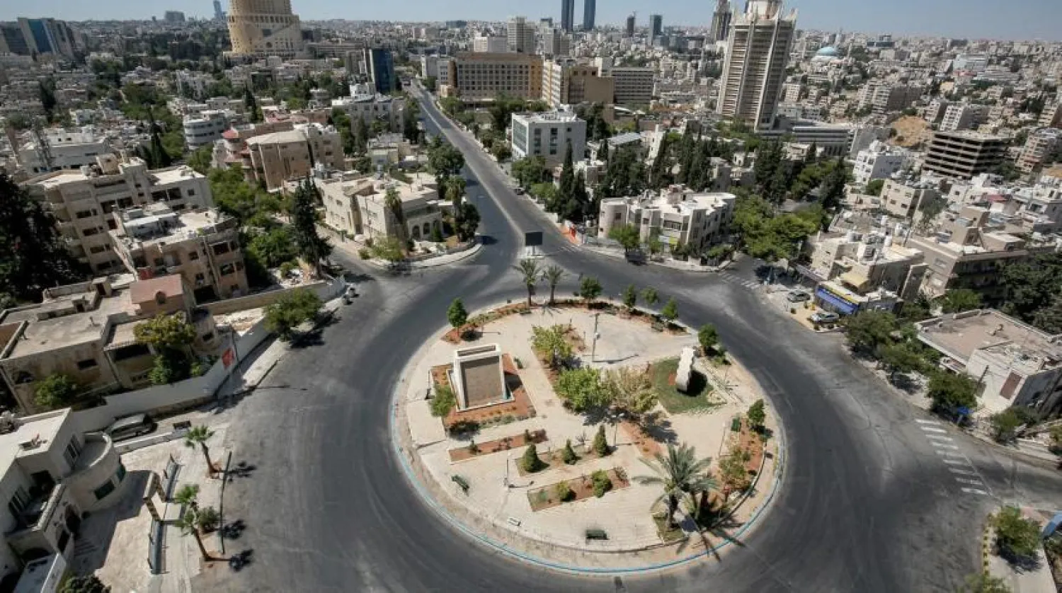 General view of an empty roundabout during a COVID-19 coronavirus pandemic curfew in the center of Jordan's capital Amman. (AFP)
