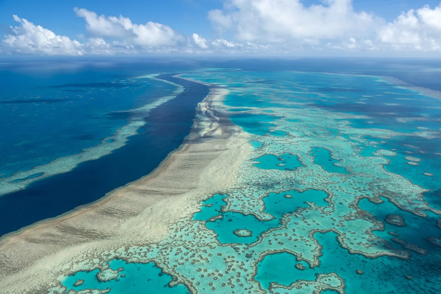 In this undated photo provided by the Great Barrier Reef Marine Park Authority, the Great Barrier Reef near the Whitsunday, Australia, region is viewed from the air. (Jumbo Aerial Photography/Great Barrier Reef Marine Park Authority via AP)