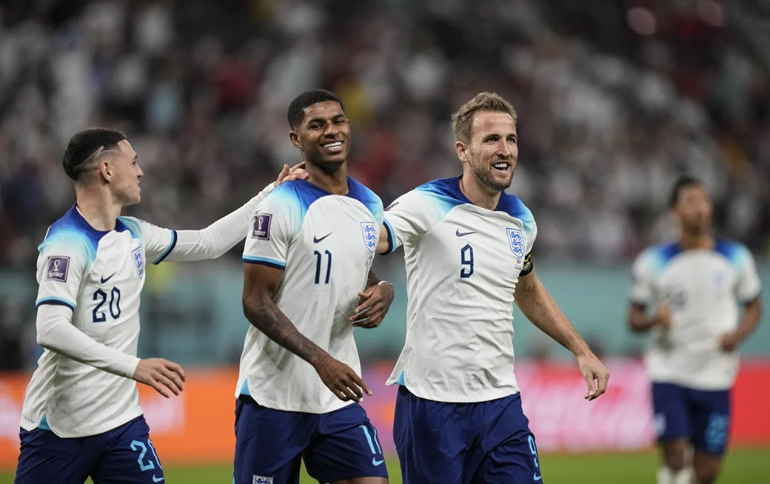 England's Marcus Rashford, second left, is congratulated by teammates after scoring his side's fifth goal against Iran during the World Cup group B match between England and Iran at the Khalifa International Stadium, in Doha, Qatar, Monday, Nov. 21, 2022. (AP)