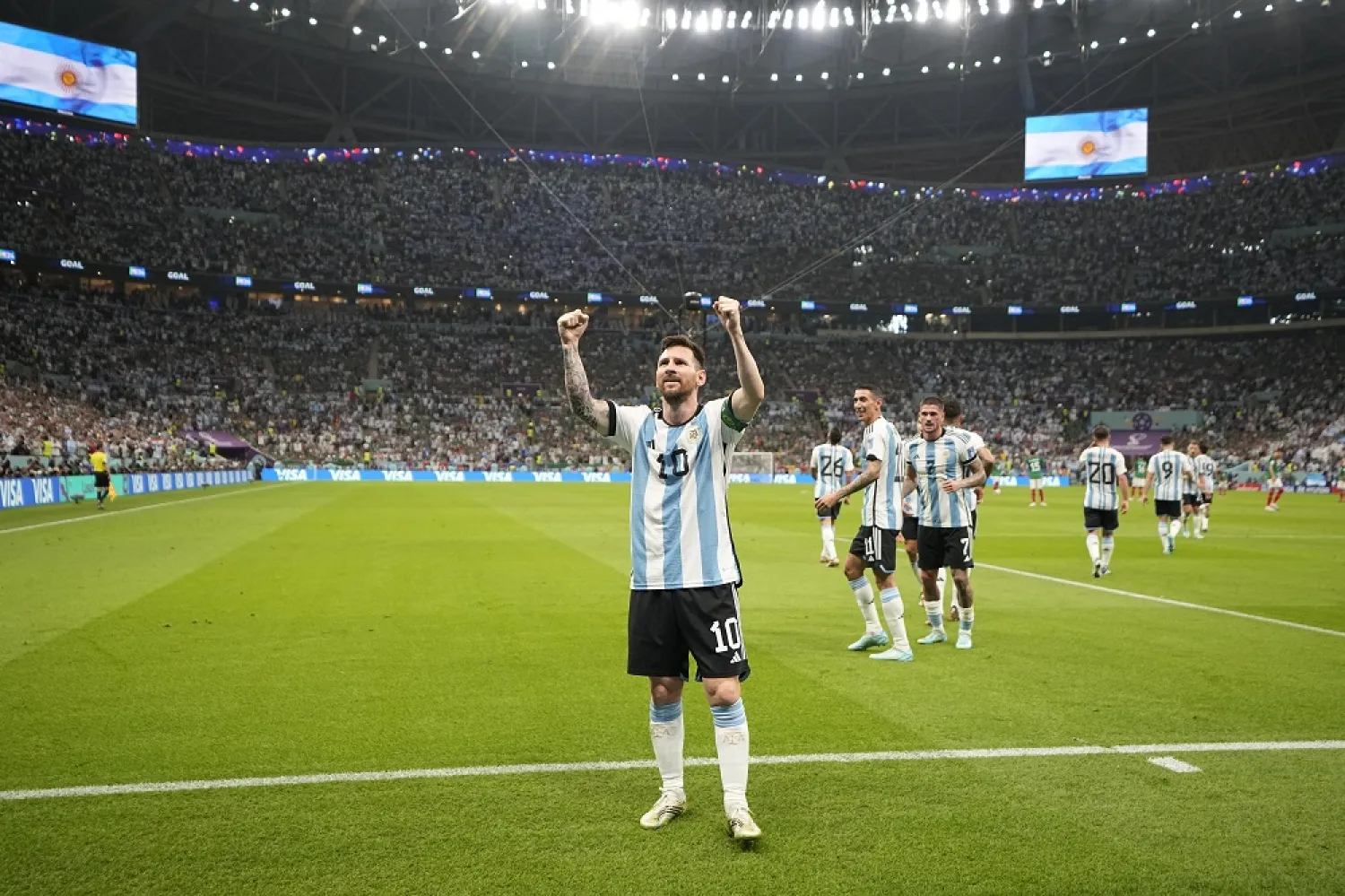 Argentina's Lionel Messi celebrates after scoring his side's opening goal during the World Cup group C match between Argentina and Mexico, at the Lusail Stadium in Lusail, Qatar, Saturday, Nov. 26, 2022. (AP)