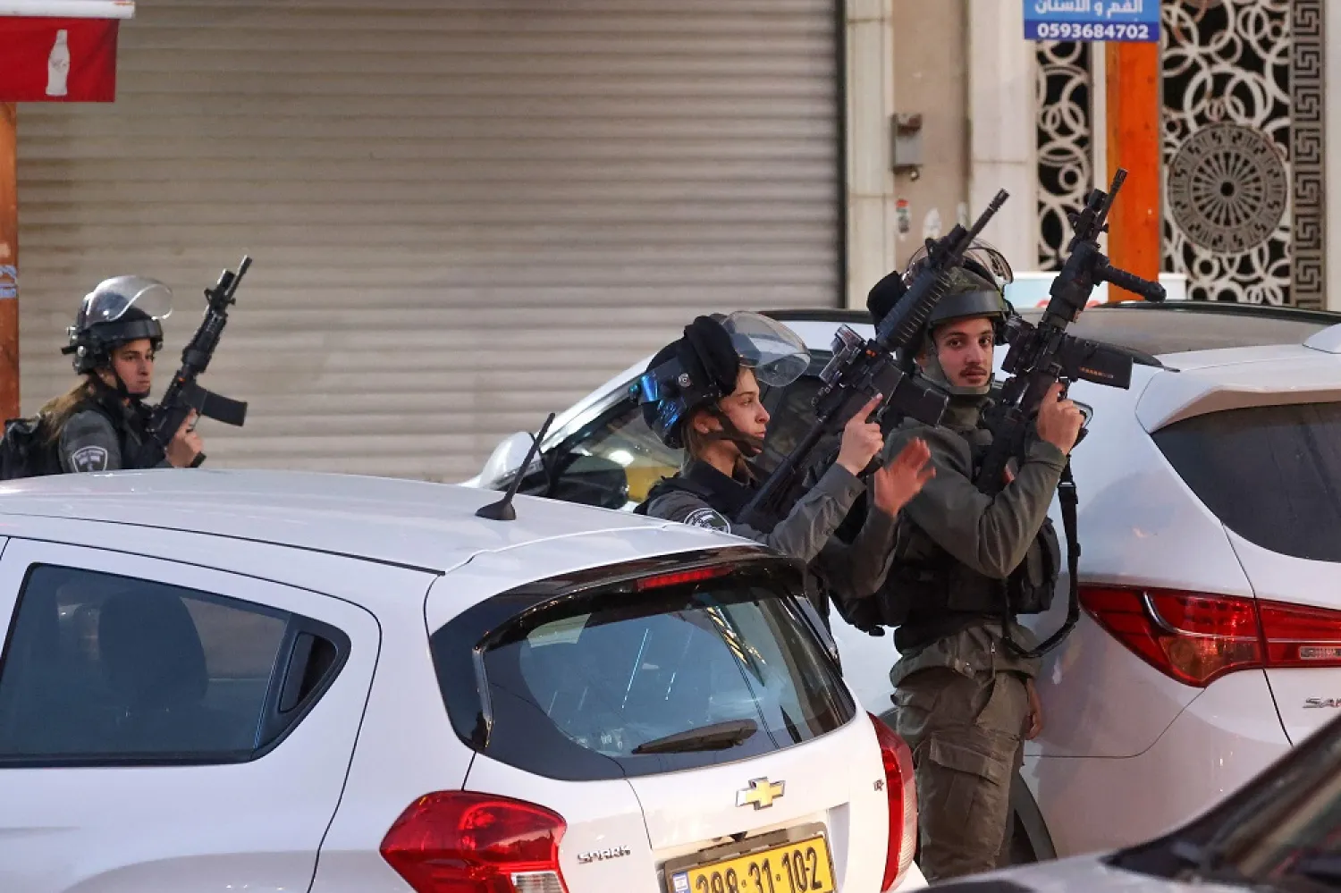 Israeli security forces are pictured during a military operation in the occupied West Bank city of Hawara, on December 2, 2022. (AFP)