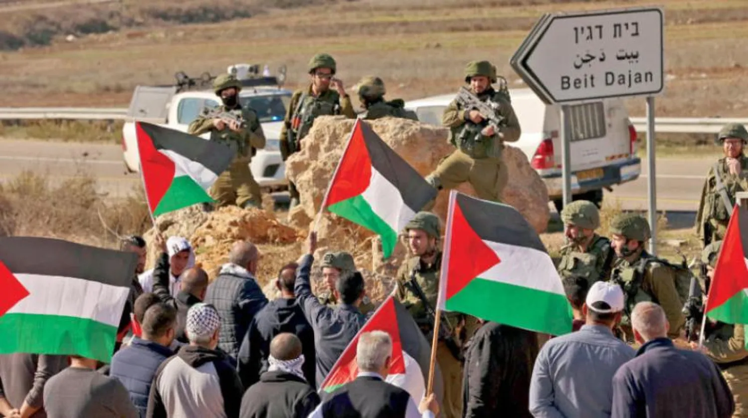İsrail güvenlik güçleri ile Batı Şeria'daki yerleşimleri protesto eden Filistinliler arasında çatışma (AFP)
