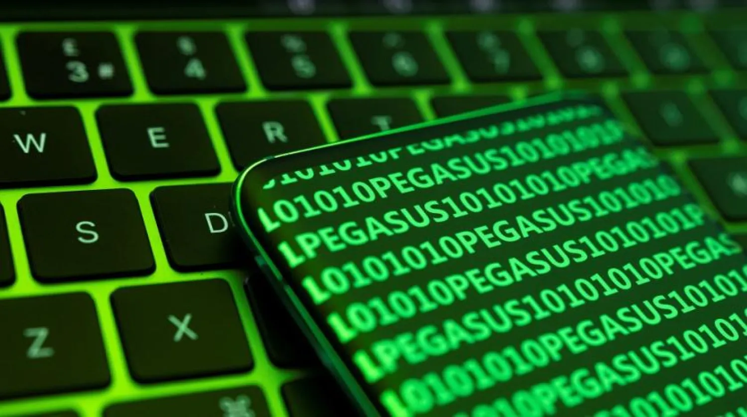 Representation photo: The word Pegasus and binary code are displayed on a smartphone which is placed on a keyboard in this illustration taken May 4, 2022. (Reuters)
