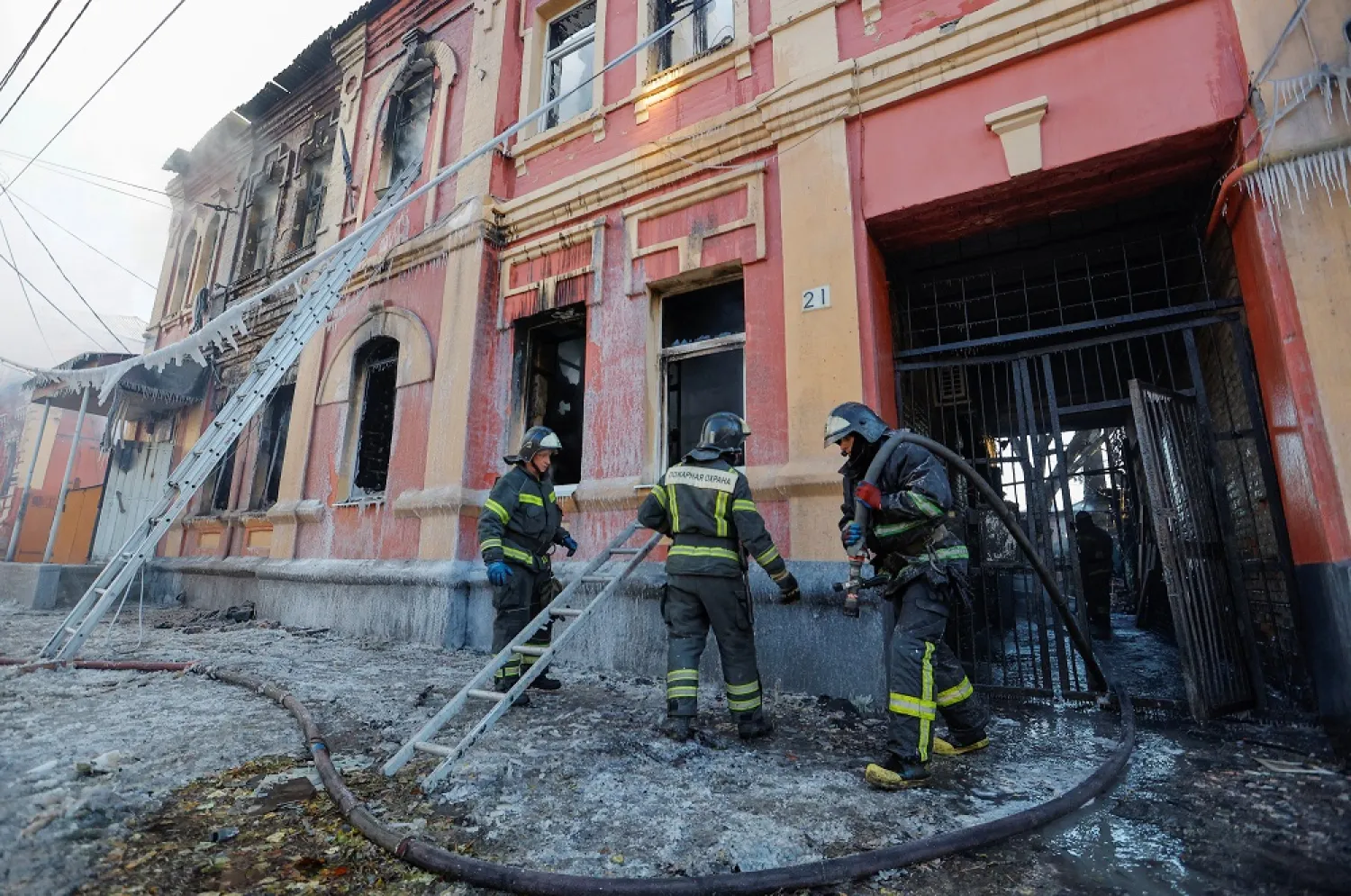 Firefighters work outside an office building heavily damaged in shelling in the course of Russia-Ukraine conflict in Donetsk, Russian-controlled Ukraine, December 5, 2022. (Reuters)