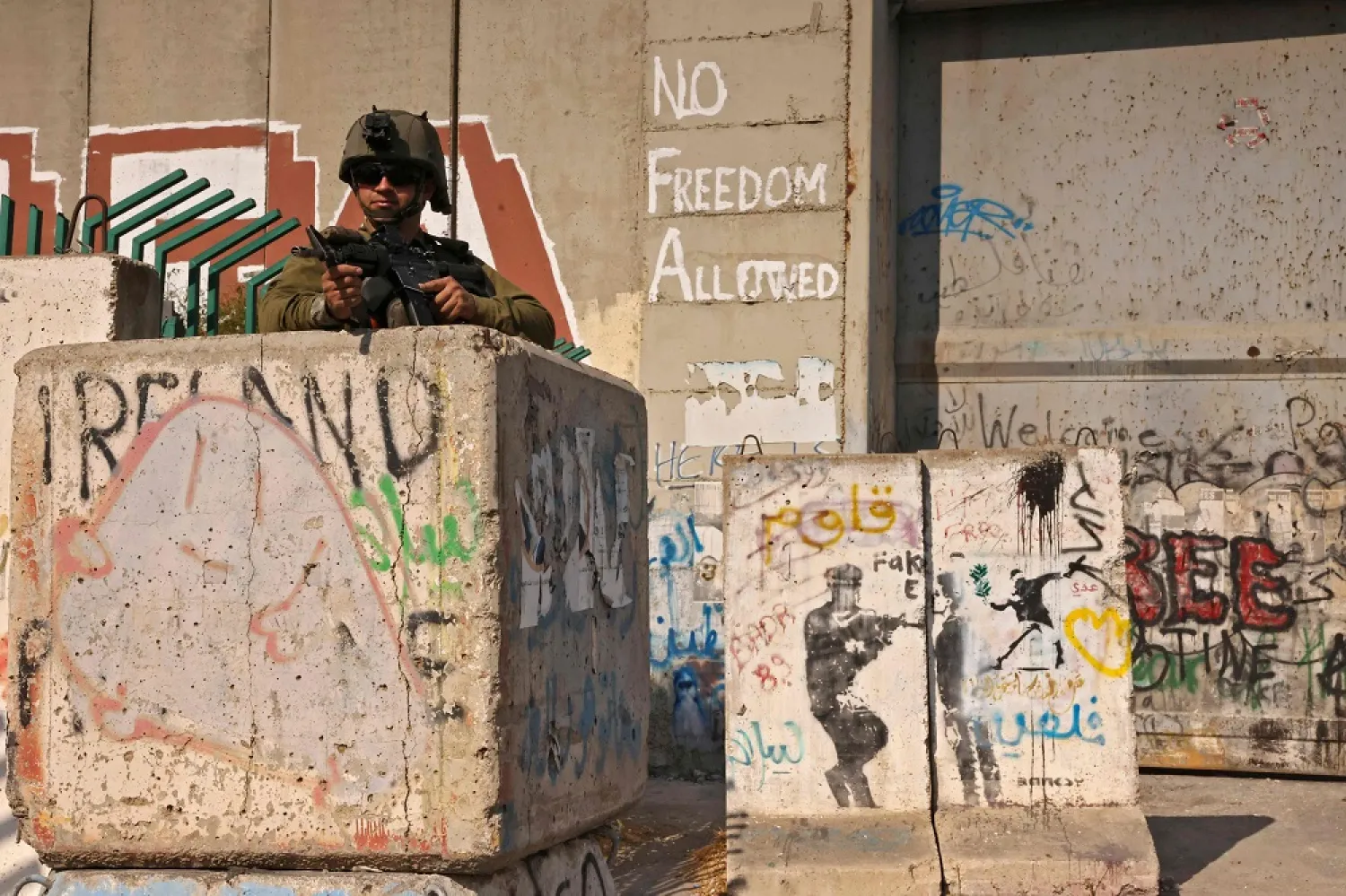 An Israeli soldier keeps position during clashes with Palestinian protesters in the city of Bethlehem in the occupied West Bank on October 20, 2022. (AFP)