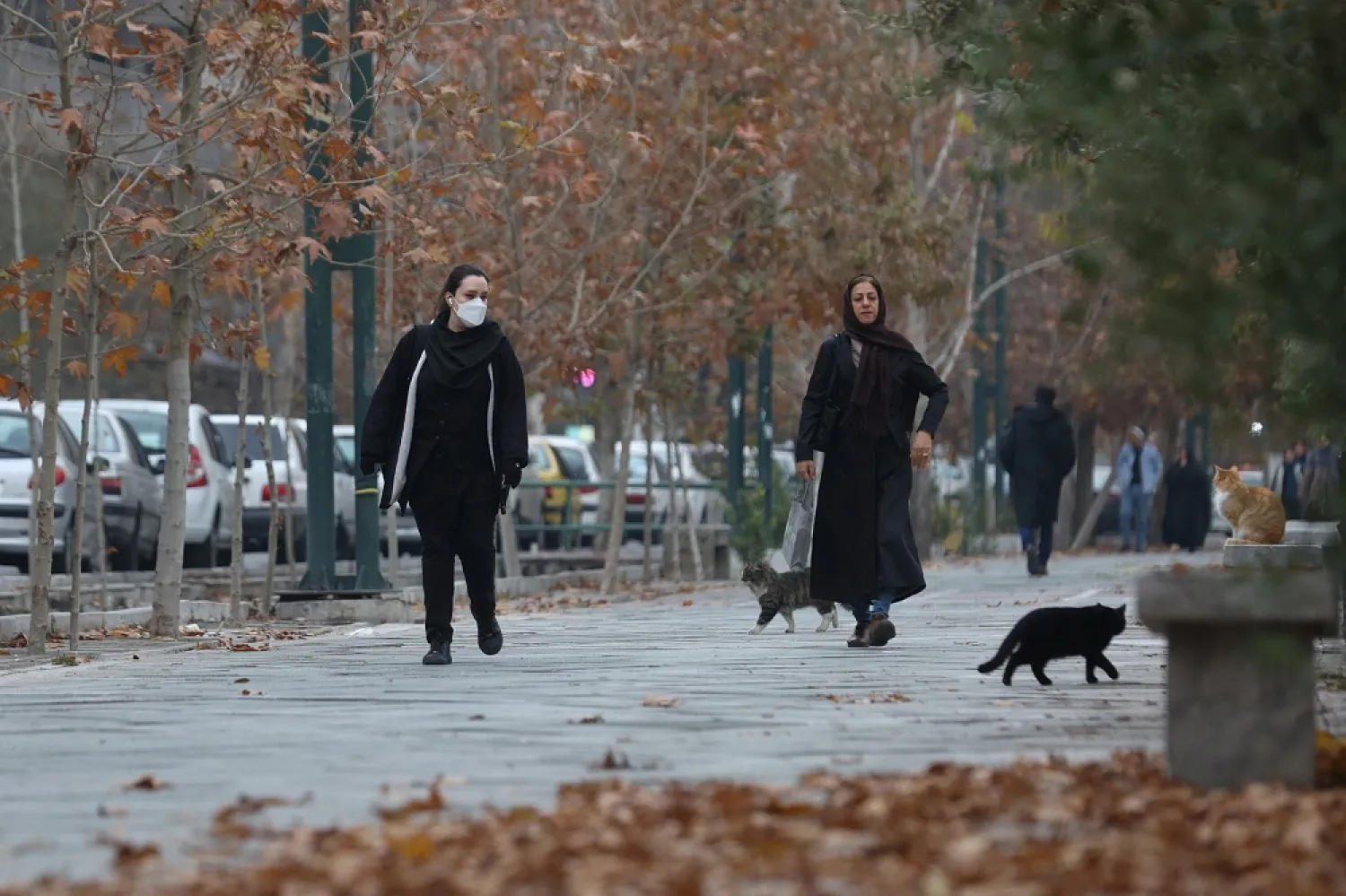 A woman walks after the morality police shut down in a street in Tehran, Iran December 6, 2022. WANA (West Asia News Agency) via Reuters