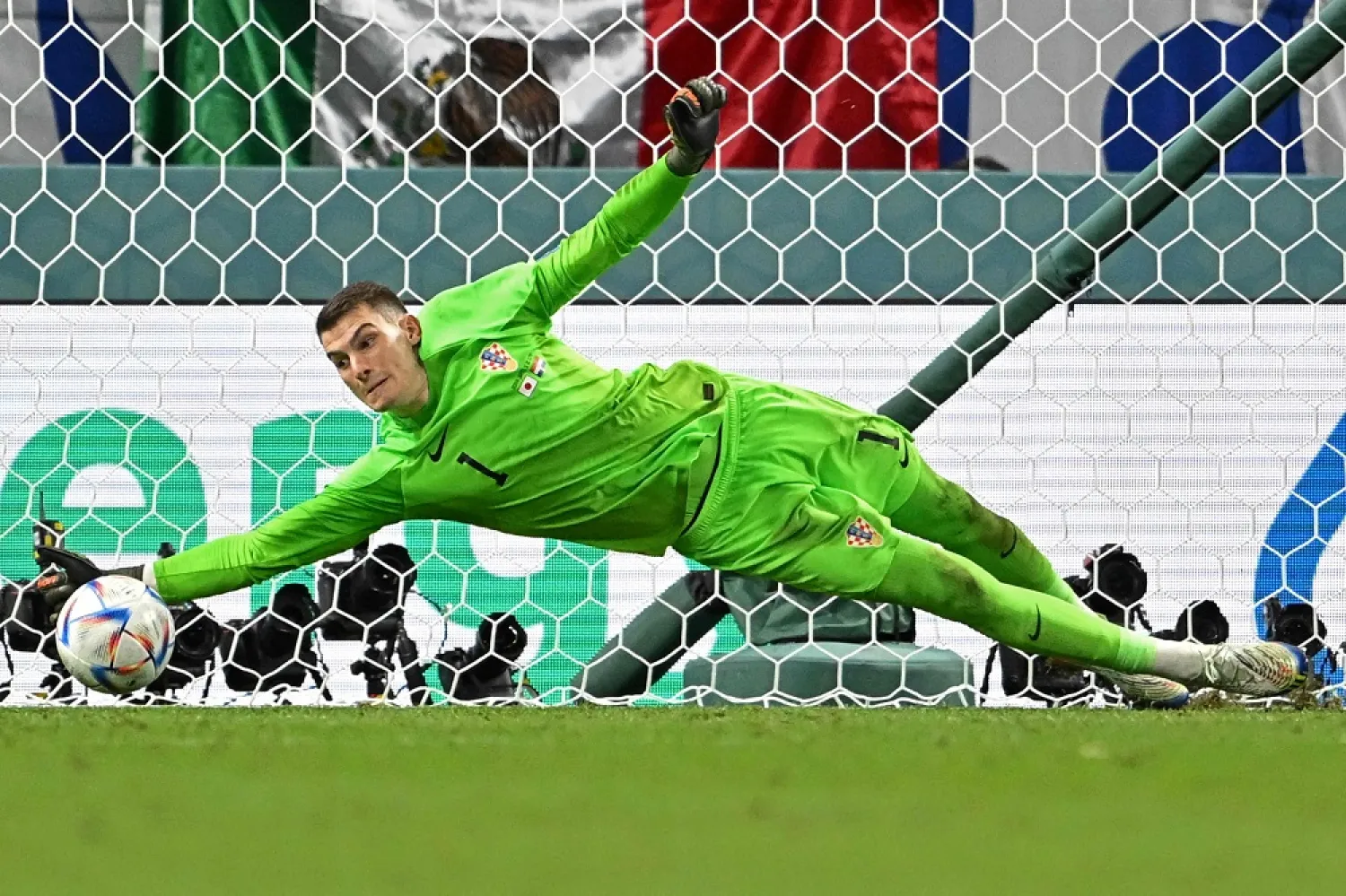 Croatia's goalkeeper #01 Dominik Livaković saves a penalty from Japan's forward #09 Kaoru Mitoma during the Qatar 2022 World Cup round of 16 football match between Japan and Croatia at the Al-Janoub Stadium in Al-Wakrah, south of Doha on December 5, 2022. (AFP)