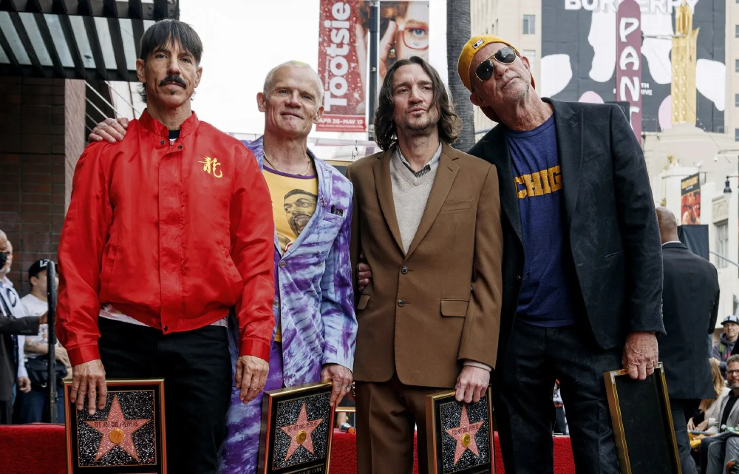 Anthony Kiedis, from left, Flea, John Frusciante and Chad Smith, of Red Hot Chili Peppers, attend a ceremony honoring the band with a star on the Hollywood Walk of Fame on Thursday, March 31, 2022, in Los Angeles. (AP)