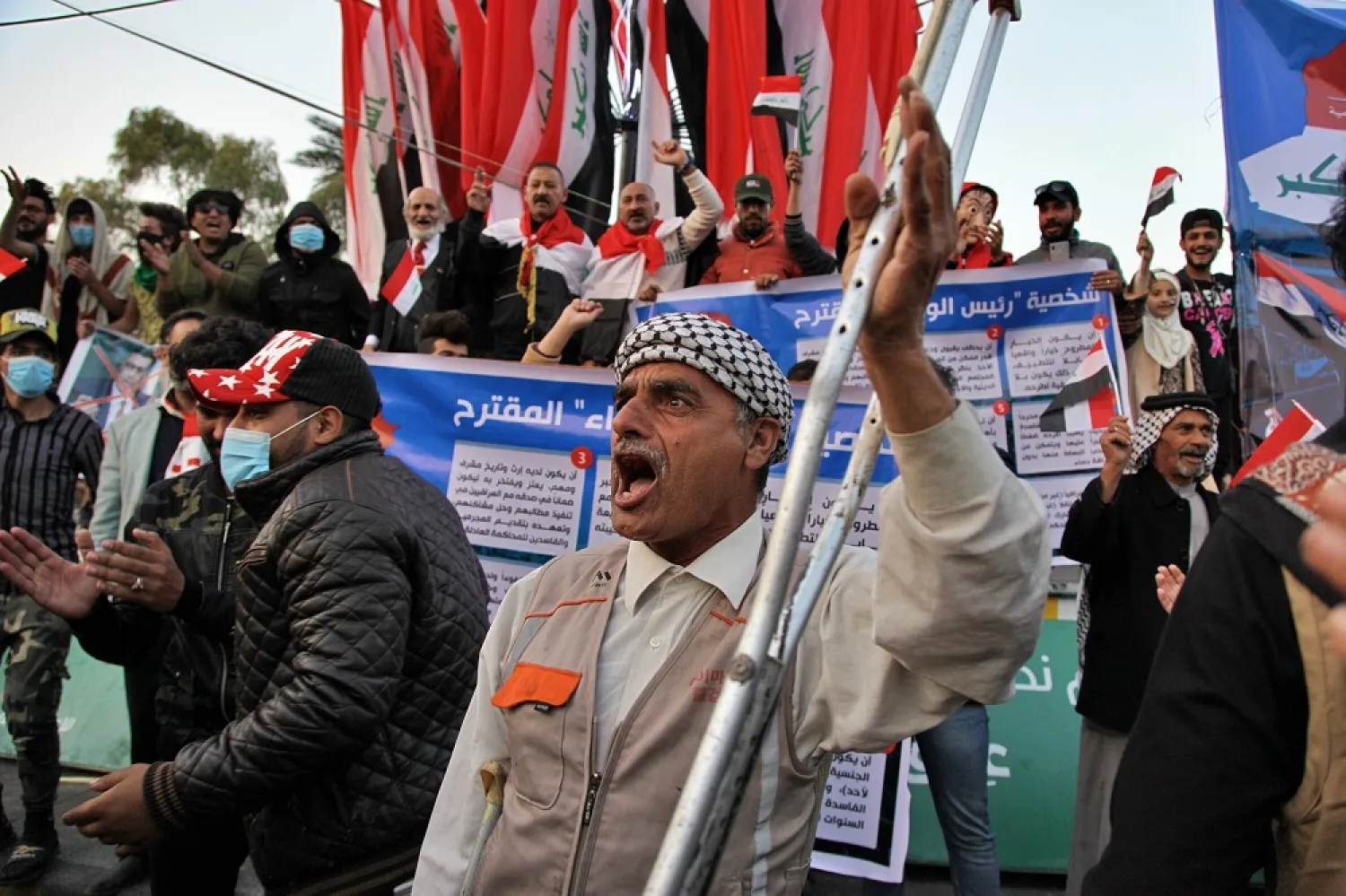 Protesters chant slogans against Iran in Tahrir Square during anti-government demonstrations in Baghdad, Iraq, Dec. 26, 2019. (AP)