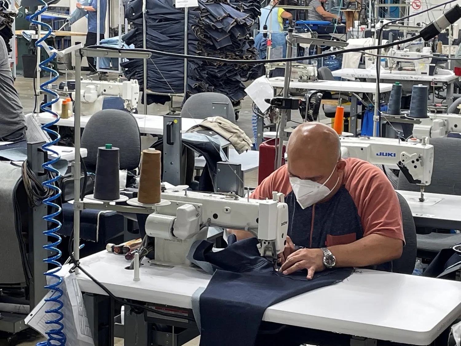 A worker sews blue jeans at Saitex's factory in Los Angeles, California, US, September 21, 2022. (Reuters)