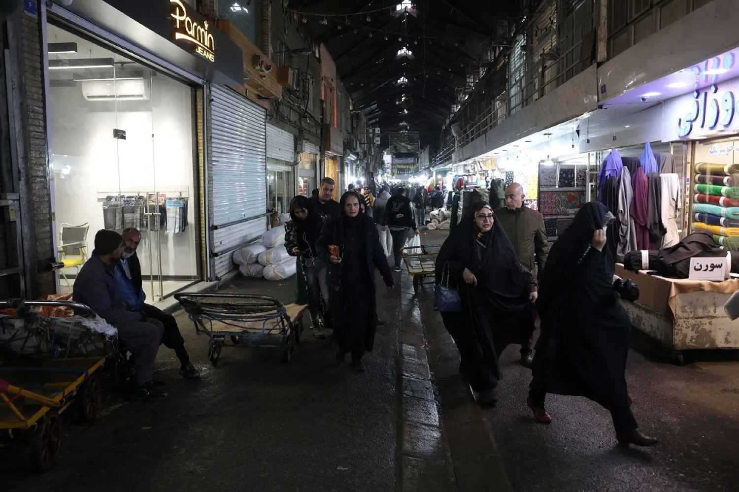 Iranians walk through Tehran Bazaar, in Tehran, Iran December 5, 2022. WANA (West Asia News Agency) via Reuters