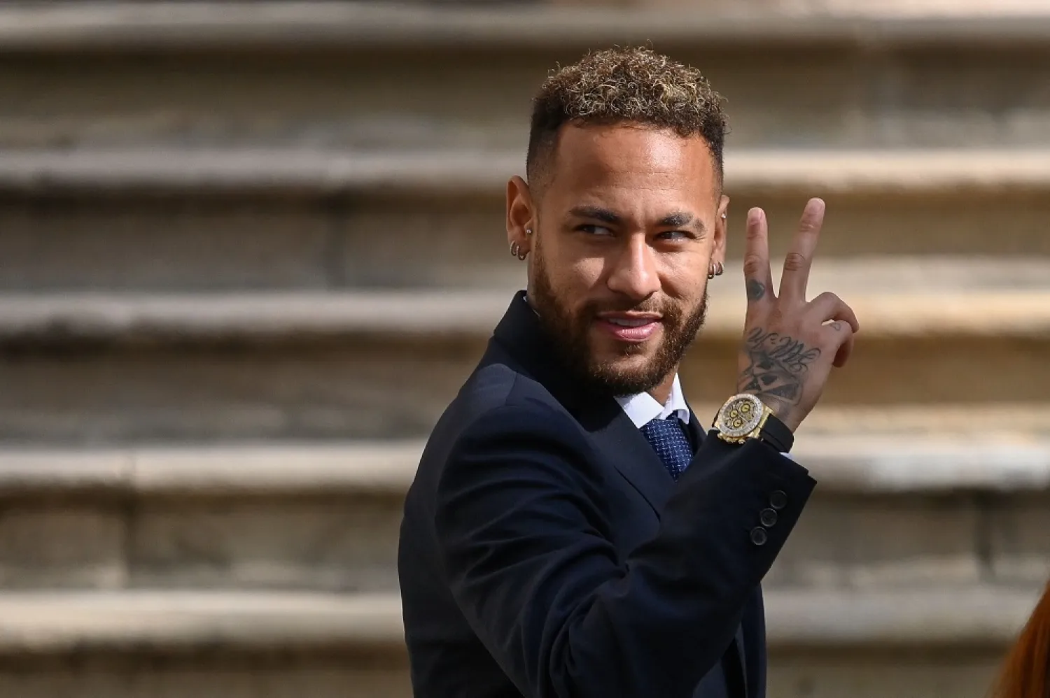 In this file photo taken on October 18, 2022, Paris Saint-Germain's Brazilian forward Neymar gestures as he leaves after attending a hearing at the courthouse in Barcelona, on the second day of his trial. (AFP)