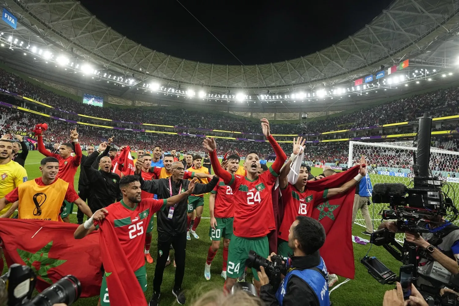 Morocco's players celebrate after the World Cup quarterfinal match between Morocco and Portugal, at Al Thumama Stadium in Doha, Qatar, Saturday, Dec. 10, 2022. (AP)