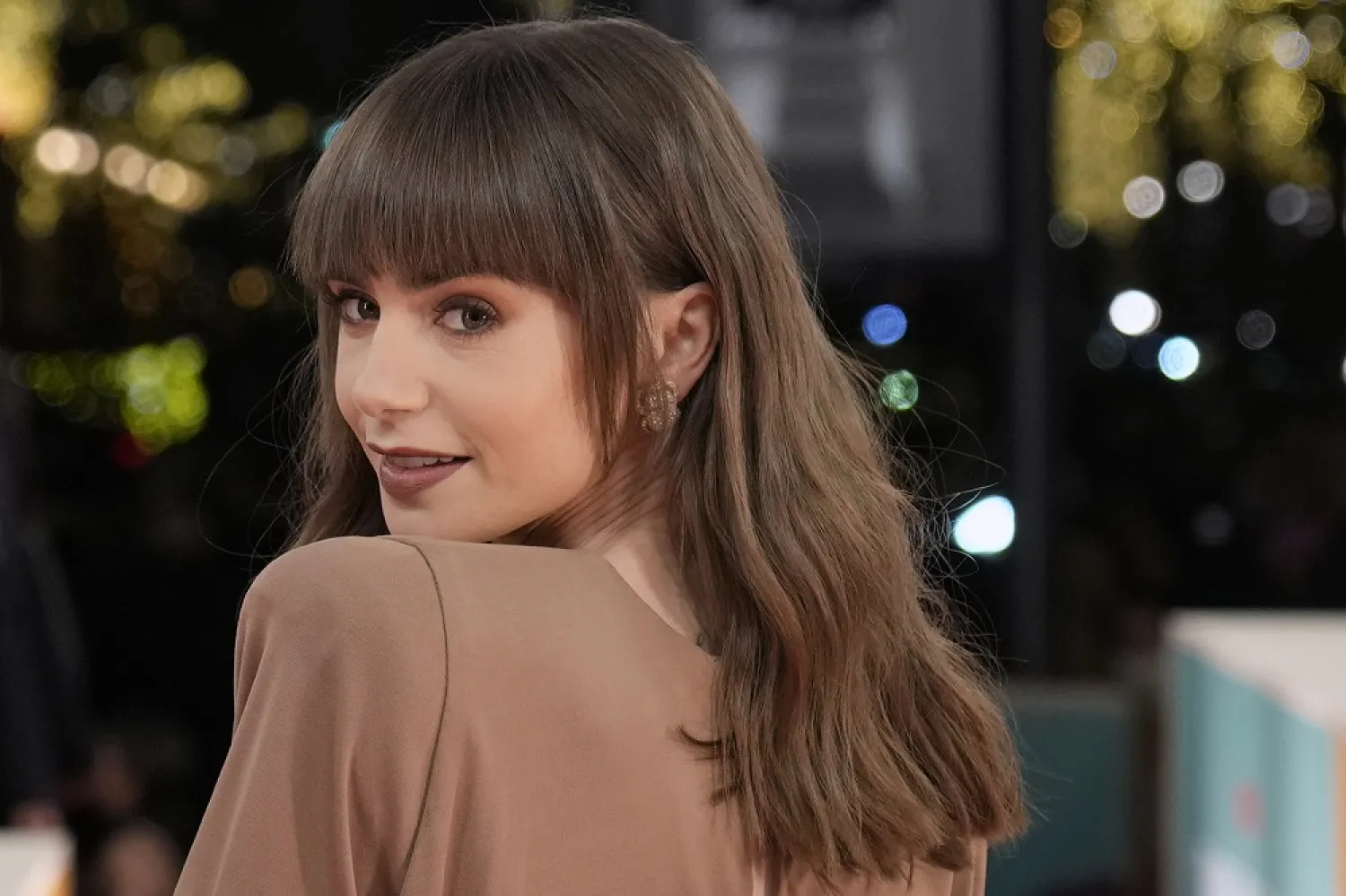 Lily Collins arrives the World Premiere of the Netflix Series "Emily in Paris" season 3, at the Theatre des Champs Elysees, in Paris, Tuesday, Dec. 6, 2022. (AP)