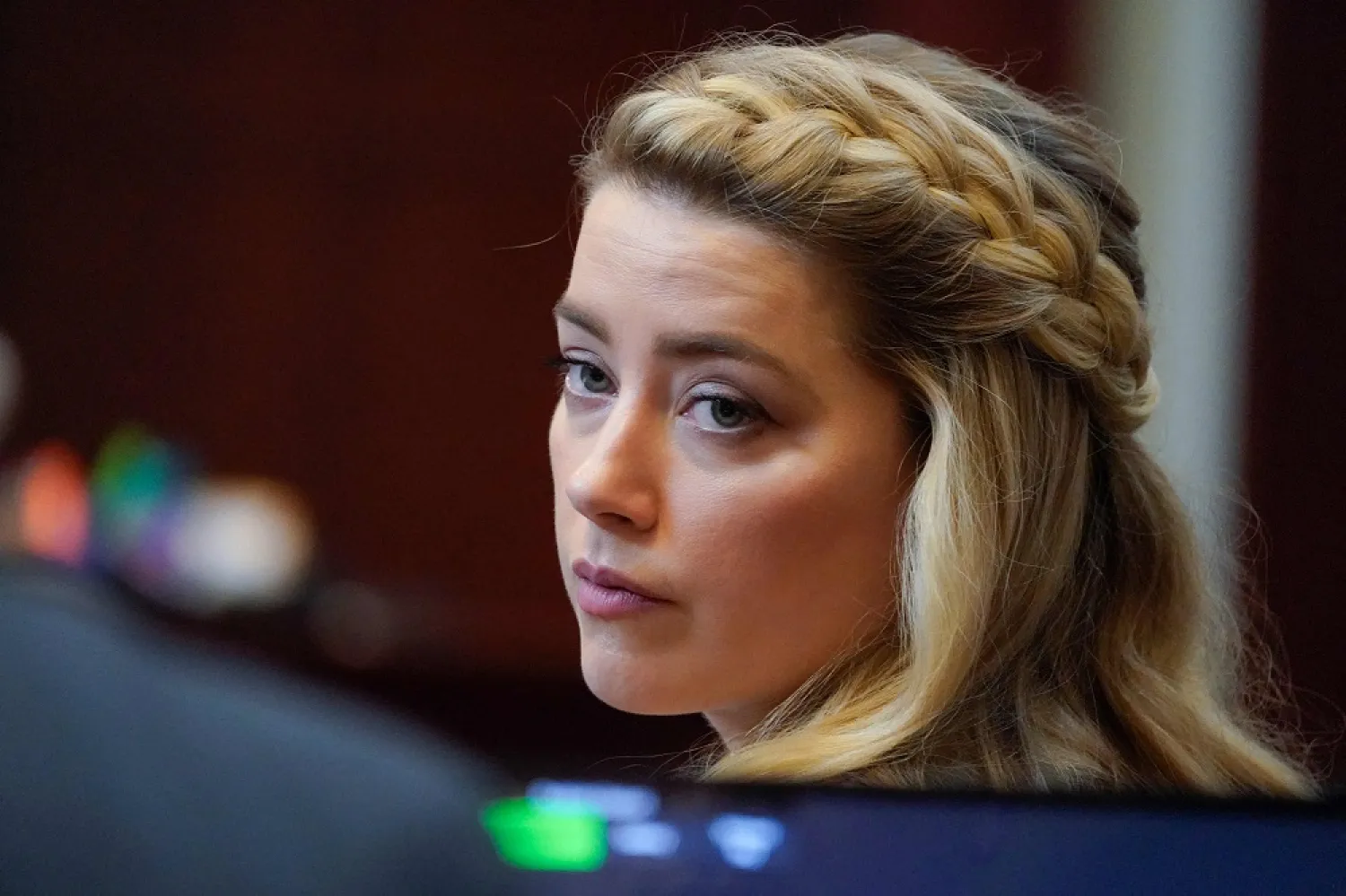 In this file photo taken on May 27, 2022 actor Amber Heard arrives for closing arguments in the Depp v. Heard trial at the Fairfax County Circuit Courthouse in Fairfax, Virginia. (AFP)