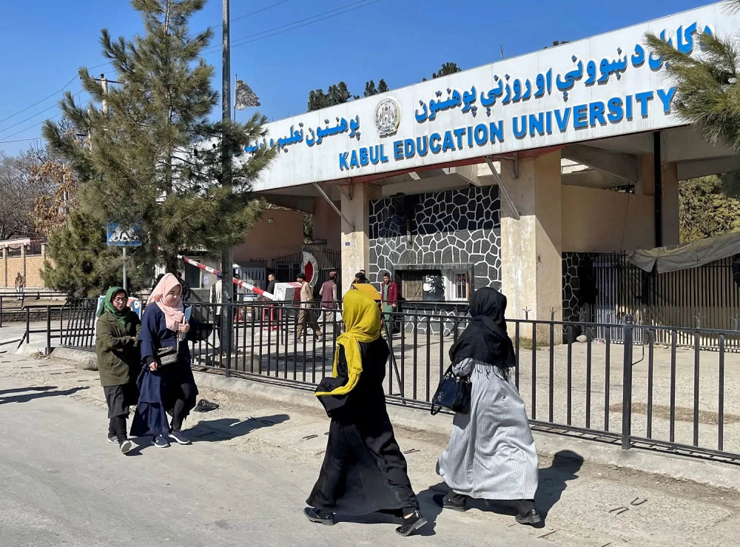  Female students walk in front of the Kabul Education University in Kabul, Afghanistan, February 26, 2022. (Reuters)