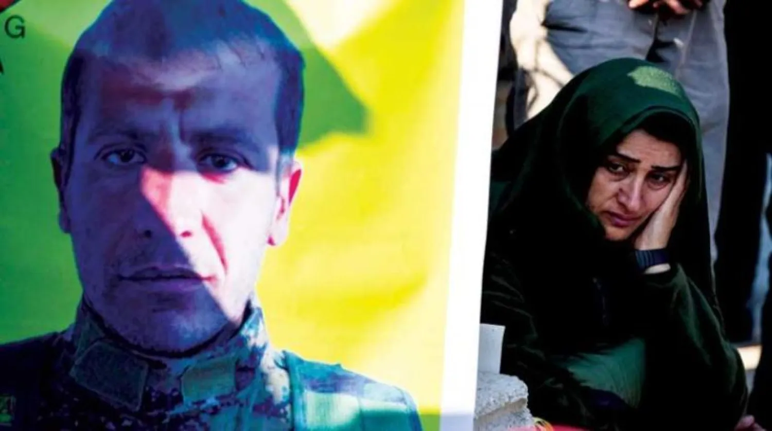 Mourners attend the funeral procession of a fighter of the Kurdish People's Protection Units (YPG), in Syria's northeastern Kurdish-majority city of Qamishli, on December 7, 2022. (Photo by Delil SOULEIMAN / AFP)