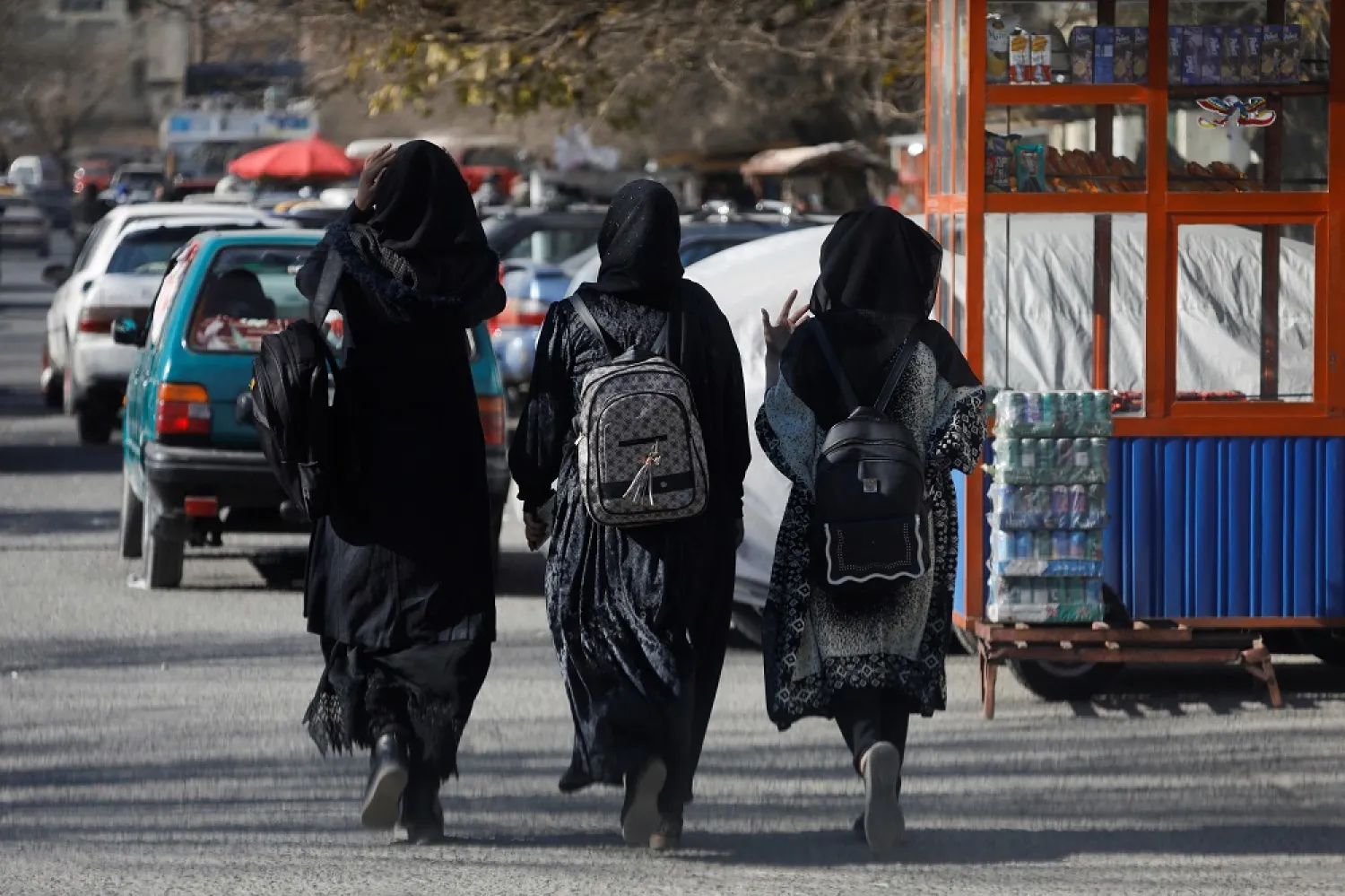 Afghan female students walk near Kabul University in Kabul, Afghanistan, December 21, 2022. (Reuters)