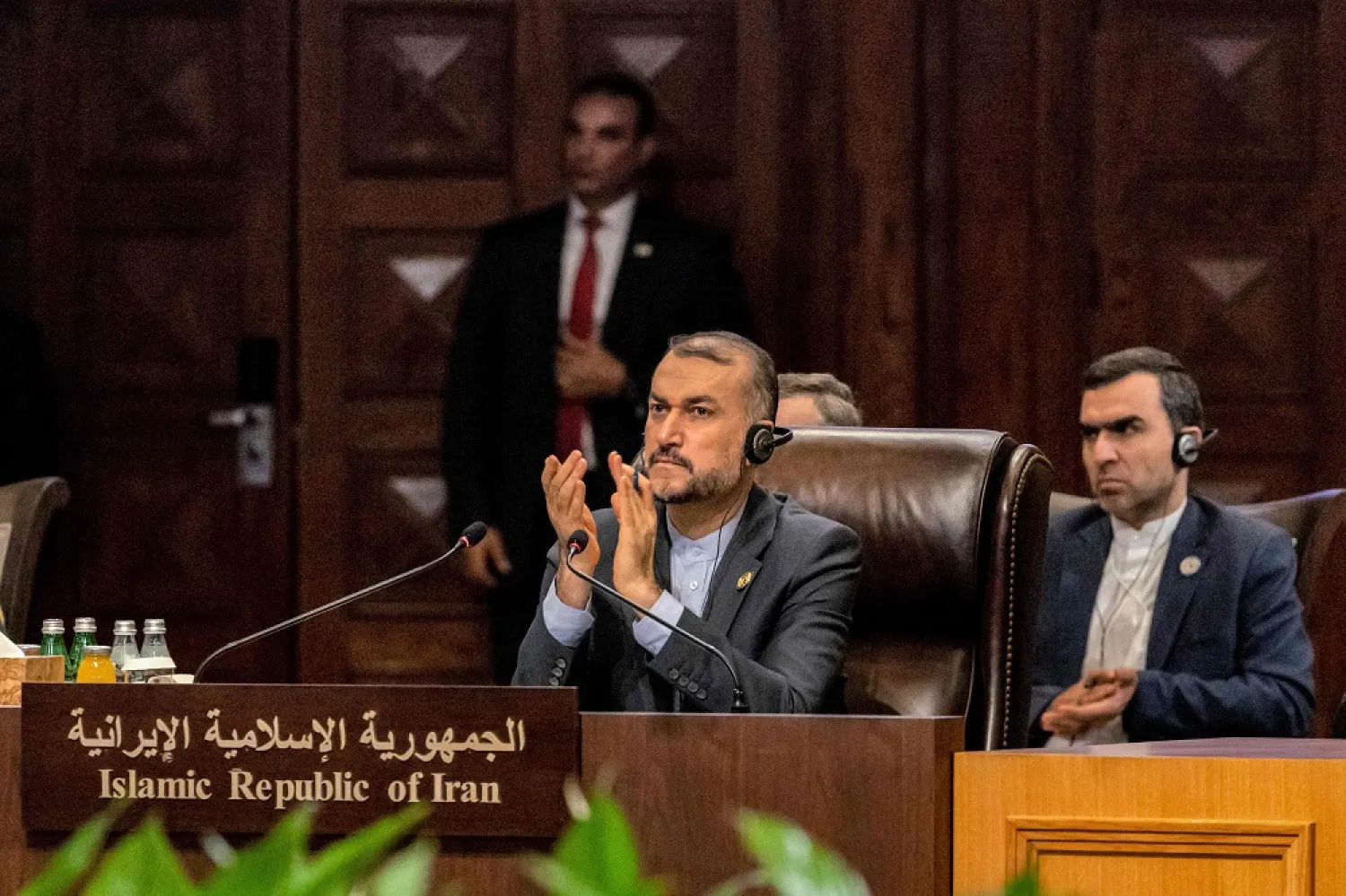 A handout picture released by the Jordanian Royal Palace shows Iran's Foreign Minister Hossein Amir-Abdollahian (L) attending the Baghdad Conference for Cooperation and Partnership in Sweimeh by the Dead Sea shore in central-west Jordan on December 20, 2022. (Photo by Jordanian Royal Palace / AFP)
