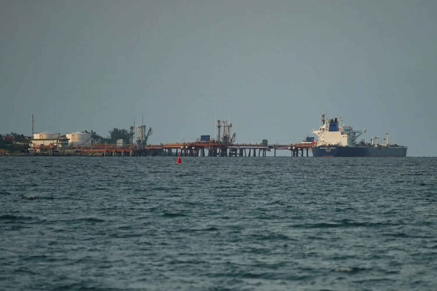 Liberia-flagged Aframax tanker Suvorovsky Prospect discharges fuel oil from Russia at the Matanzas terminal, in Matanzas, Cuba, July 16, 2022. (Reuters)