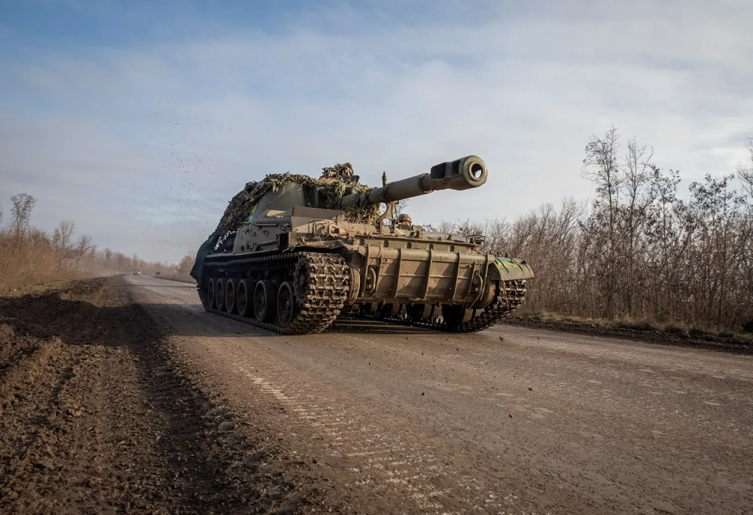 Ukrainian servicemen ride a self-propelled howitzer, amid Russia's attack on Ukraine, near Bakhmut, Ukraine December 23, 2022. (Reuters)