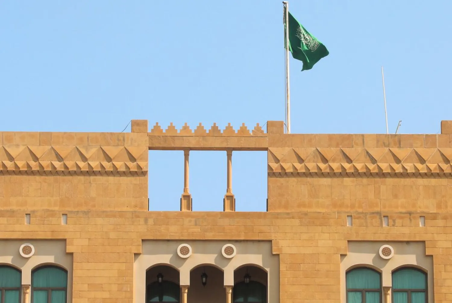 A Saudi flag flutters atop Saudi Arabia's embassy in Beirut, Lebanon May 18, 2022. REUTERS/Mohamed Azakir 

