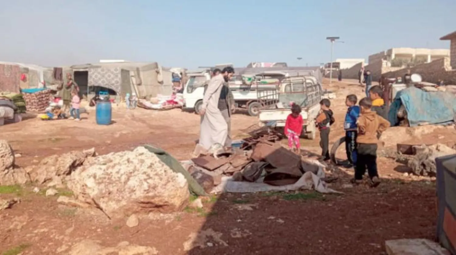 Displaced people in camps sell scrap to buy food. (Asharq Al-Awsat)