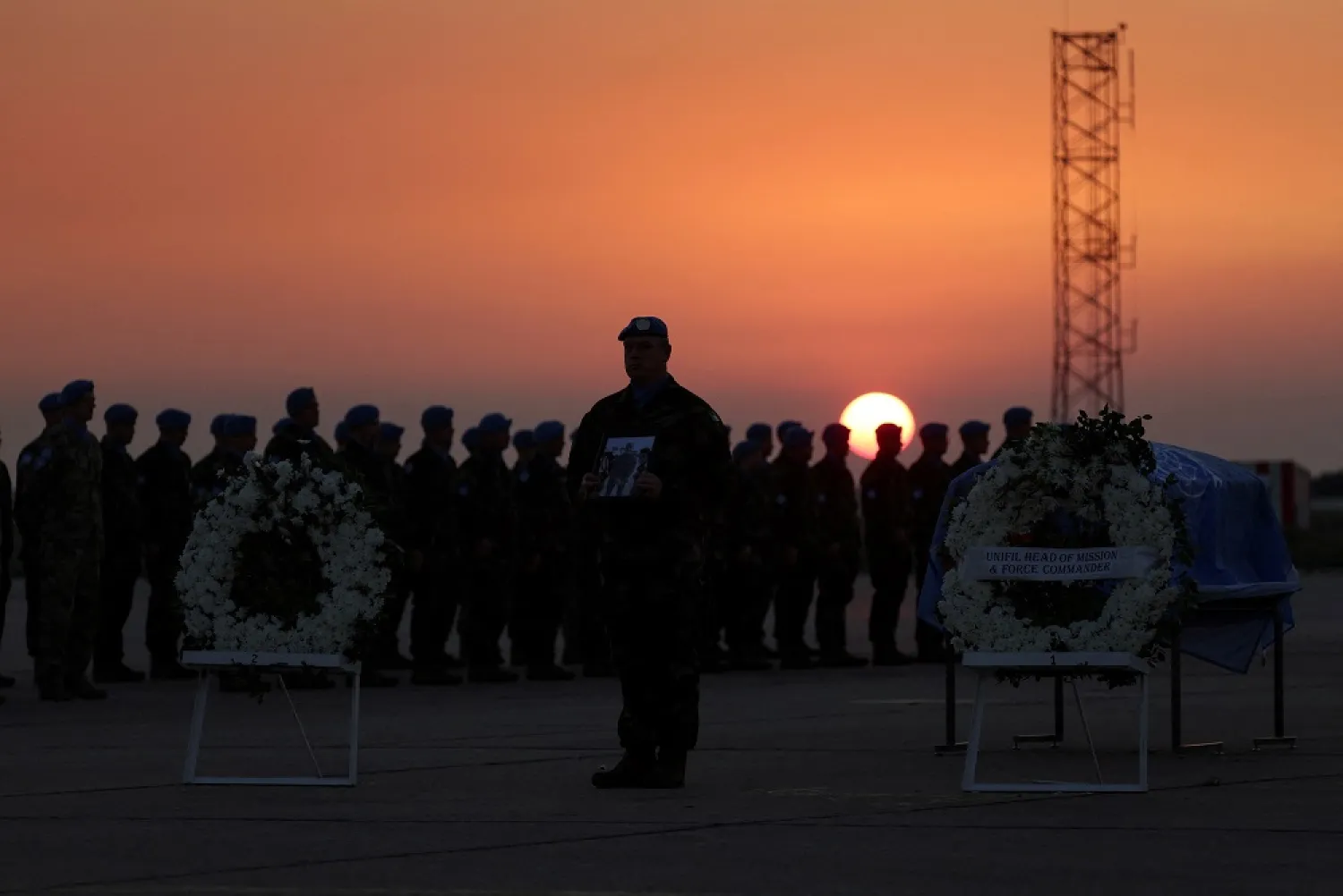 Members of the United Nations Interim Force in Lebanon (UNIFIL) peacekeeping mission attend the repatriation ceremony for Irish soldier Sean Rooney who was killed on a UN peacekeeping patrol, at Beirut International Airport, in Beirut, Lebanon December 18, 2022. (Reuters)