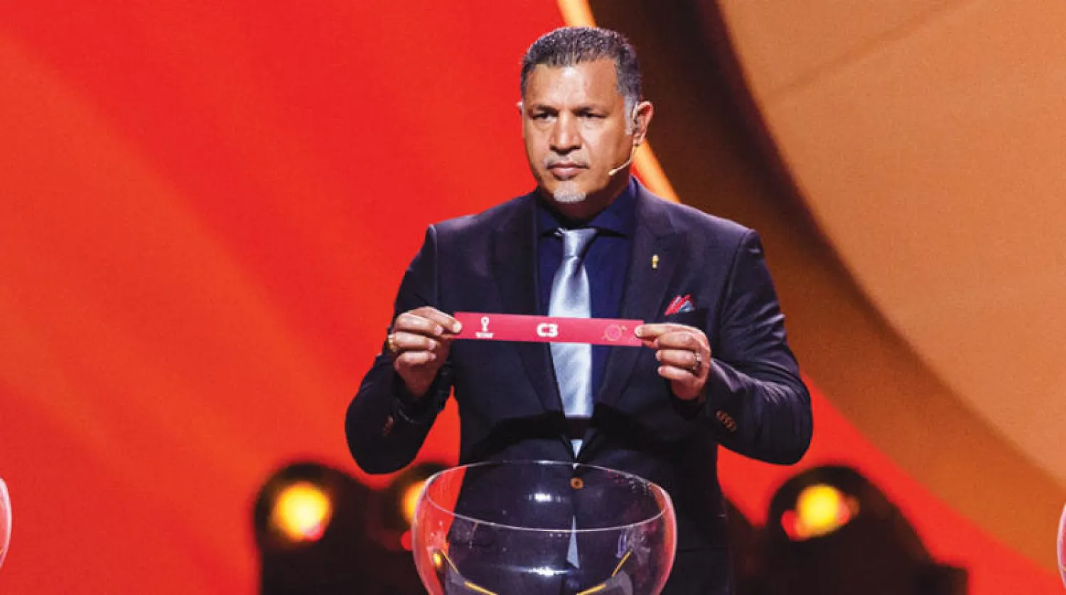 دائي خلال القرعة النهائية لكأس العالم قطر 2022 في مركز الدوحة للمعارض 1 أبريل 2022 في الدوحة (غيتي)