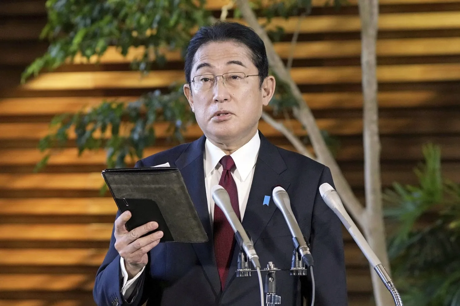 Japanese Prime Minister Fumio Kishida speaks before the media at his official residence in Tokyo, Tuesday, Dec. 27, 2022, after Kenya Akiba, minister in charge of reconstruction of Fukushima and other disaster-hit areas, submitted his resignation. (AP)
