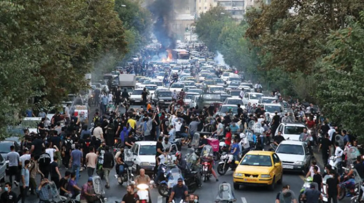 Protesters clash with police after taking to the streets in Tehran in wake of the death of Mahsa Amini, September 21. (AFP)